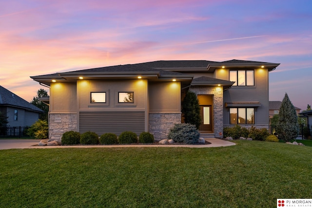 21034 X St, Omaha, NE 68022 - prairie-style home featuring stone siding, stucco siding, a lawn, and a shingled roof