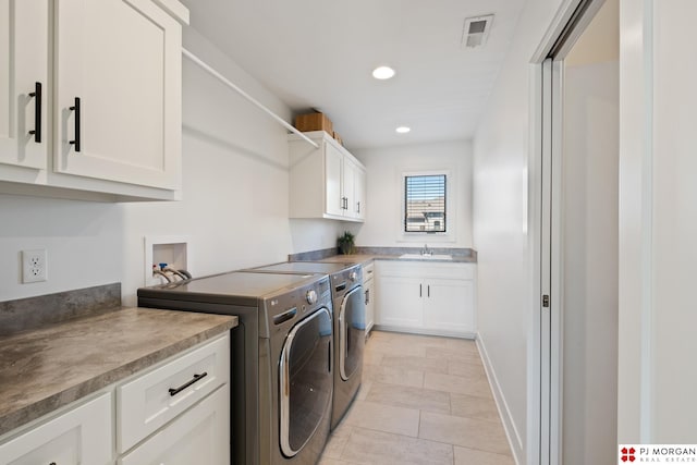 21034 X St, Omaha, NE 68022 - laundry room featuring washing machine and clothes dryer, cabinet space, recessed lighting, and light tile patterned floors