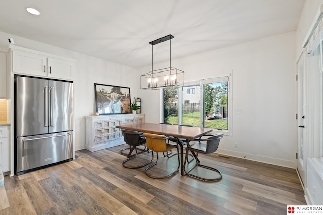 21034 X St, Omaha, NE 68022 - dining space featuring wood finished floors, a chandelier, and recessed lighting
