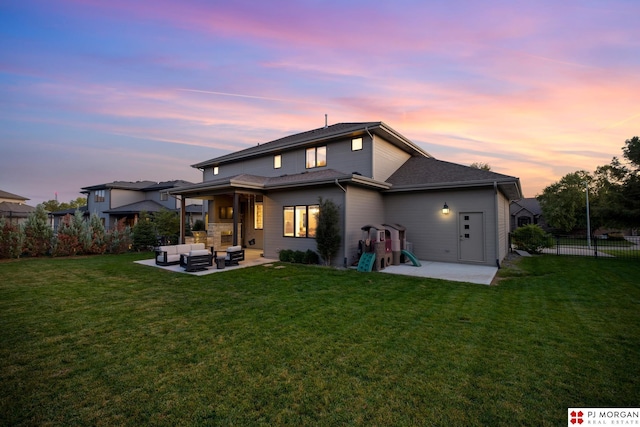21034 X St, Omaha, NE 68022 - back of house at dusk featuring outdoor lounge area, a patio area, and a shingled roof