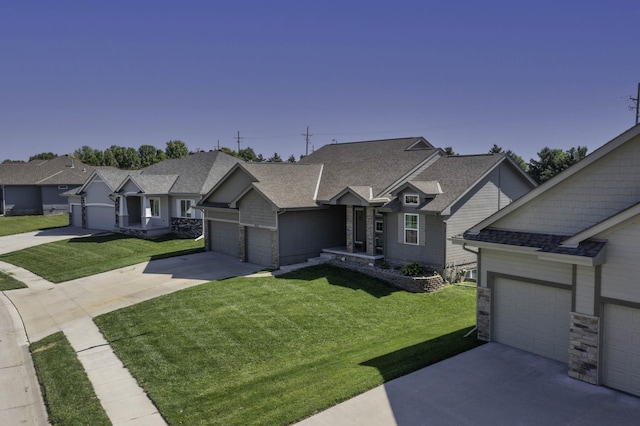 6015 S 193rd St, Omaha, NE 68135 - view of front of property with concrete driveway, a front yard, a shingled roof, stone siding, and an attached garage