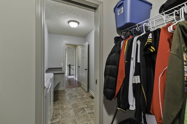 6015 S 193rd St, Omaha, NE 68135 - spacious closet featuring washer and dryer and stone finish floors