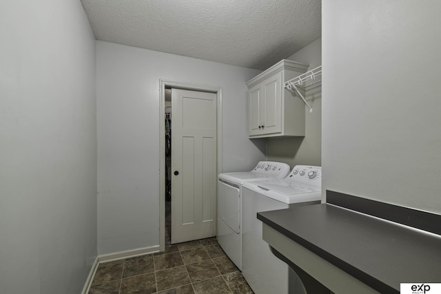 6015 S 193rd St, Omaha, NE 68135 - laundry room featuring cabinet space, washing machine and clothes dryer, and a textured ceiling
