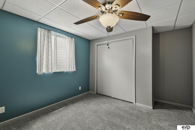 6015 S 193rd St, Omaha, NE 68135 - unfurnished bedroom with carpet floors, a paneled ceiling, a closet, and a ceiling fan