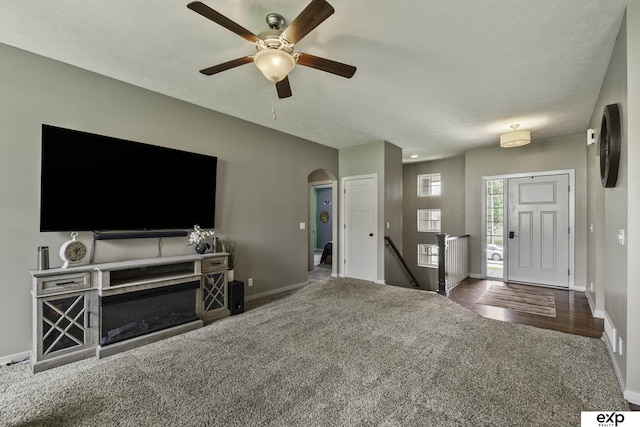 6015 S 193rd St, Omaha, NE 68135 - carpeted living room featuring a ceiling fan and arched walkways