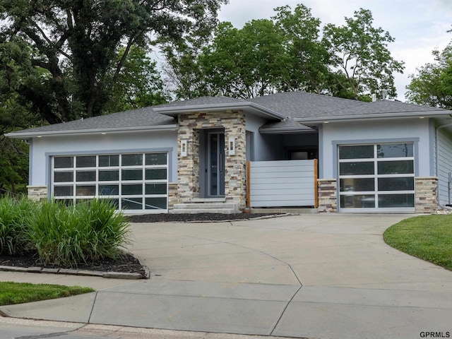 201 Bellevue Blvd N, Bellevue, NE 68005 - prairie-style home with driveway, stone siding, stucco siding, and an attached garage