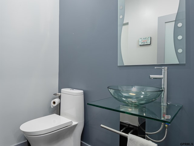 201 Bellevue Blvd N, Bellevue, NE 68005 - half bathroom featuring a sink and toilet
