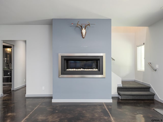 201 Bellevue Blvd N, Bellevue, NE 68005 - living room with finished concrete floors, stairway, and a glass covered fireplace