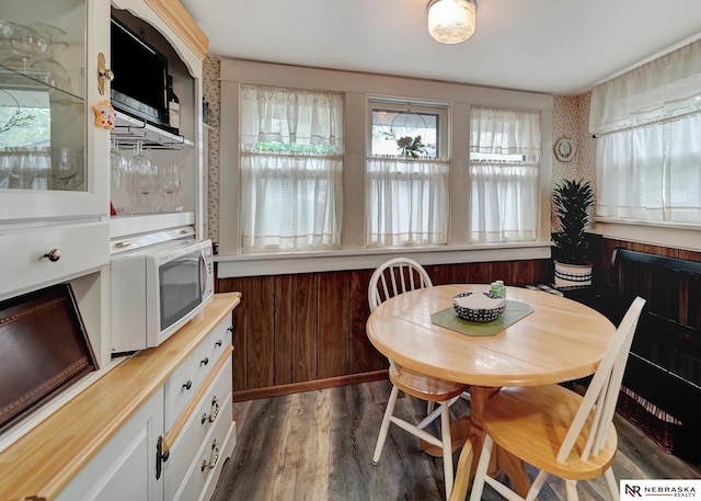 6409 Logan Ave, Lincoln, NE 68507 - dining space featuring dark wood-style flooring
