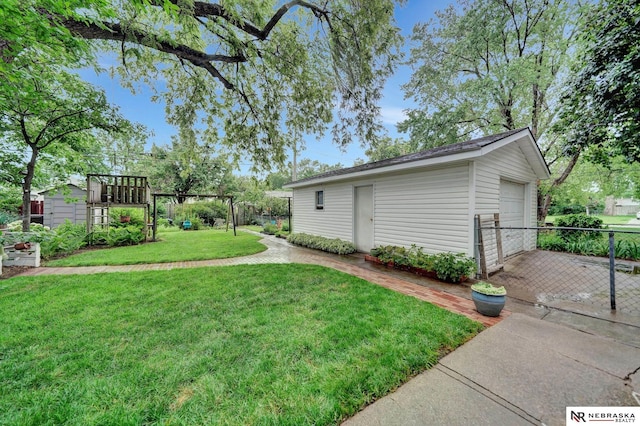 6409 Logan Ave, Lincoln, NE 68507 - view of yard with an outdoor structure and driveway