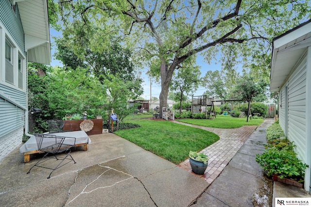 6409 Logan Ave, Lincoln, NE 68507 - fenced backyard with a patio area