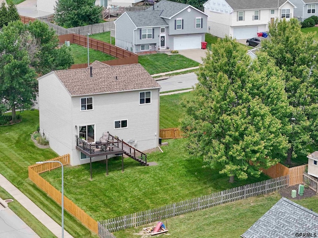15413 Bondesson St, Bennington, NE 68007 - back of property with a garage, a residential view, roof with shingles, and concrete driveway