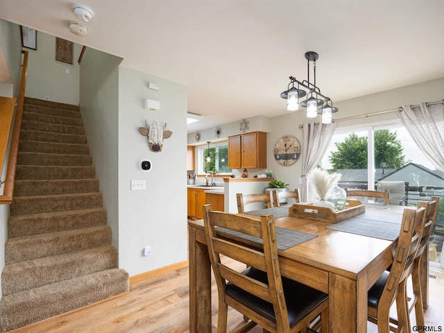 15413 Bondesson St, Bennington, NE 68007 - dining space with light wood-style floors and stairs