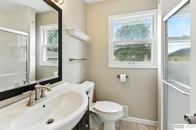 3207 S 121st St, Omaha, NE 68144 - bathroom featuring tiled shower, vanity, and tile patterned flooring