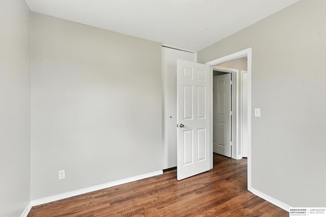 3207 S 121st St, Omaha, NE 68144 - spare room featuring dark wood-style floors and baseboards