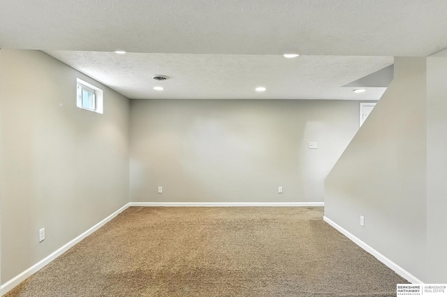 3207 S 121st St, Omaha, NE 68144 - below grade area featuring carpet, recessed lighting, and a textured ceiling