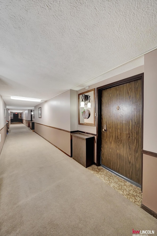 4000 S 56th St Unit 130C, Lincoln, NE 68516 - hall with carpet floors and a textured ceiling