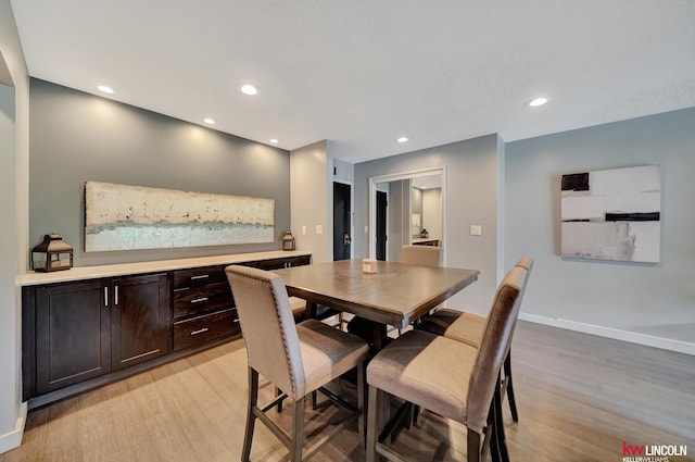 4000 S 56th St Unit 130C, Lincoln, NE 68516 - dining space featuring light wood-style flooring and recessed lighting