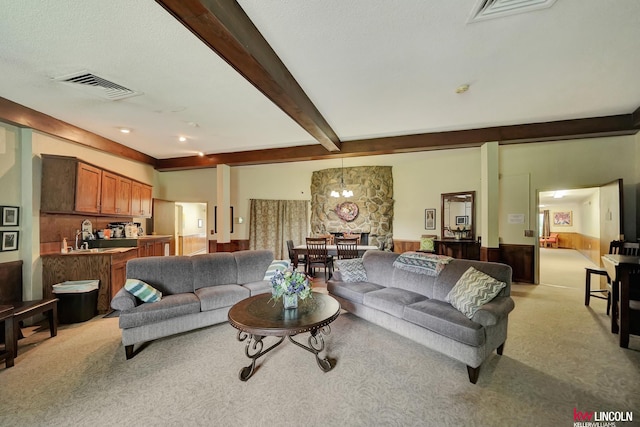 4000 S 56th St Unit 130C, Lincoln, NE 68516 - living room with beamed ceiling and light carpet