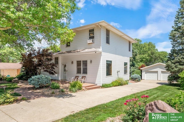 754 10th St, Syracuse, NE 68446 - view of front facade featuring an outdoor structure, a detached garage, and cooling unit