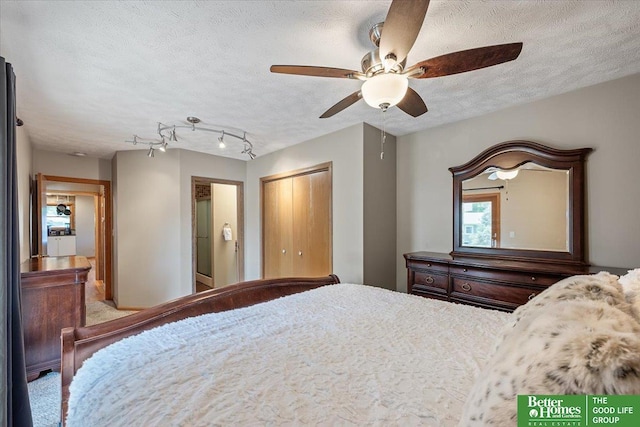 754 10th St, Syracuse, NE 68446 - carpeted bedroom featuring a textured ceiling, a closet, and ceiling fan