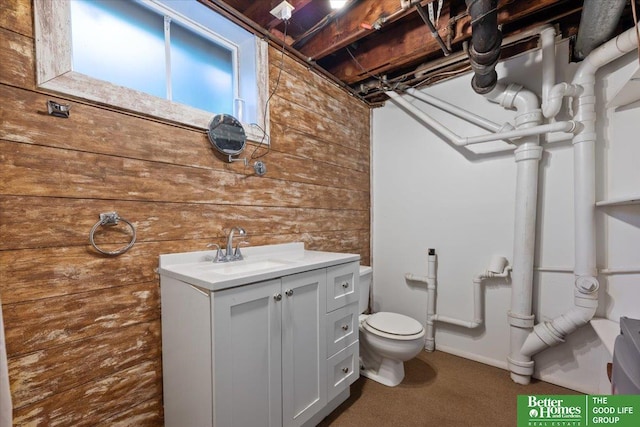754 10th St, Syracuse, NE 68446 - bathroom featuring wooden walls and vanity