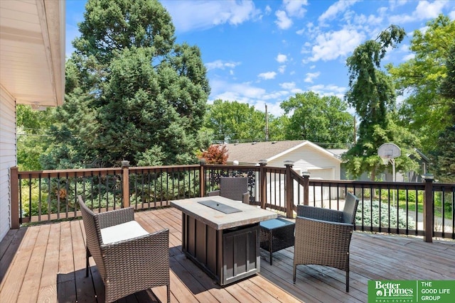 754 10th St, Syracuse, NE 68446 - wooden terrace featuring an outdoor structure and an outdoor fire pit