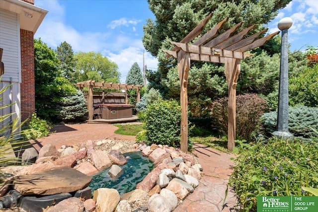 754 10th St, Syracuse, NE 68446 - view of patio / terrace with a hot tub, a pergola, and a small pond