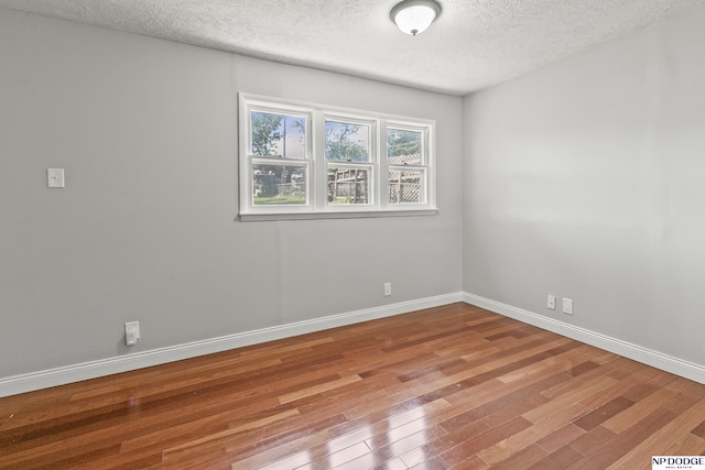 2705 Margo St, Bellevue, NE 68147 - empty room with a textured ceiling and wood finished floors