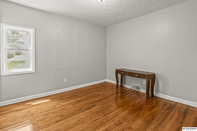 2705 Margo St, Bellevue, NE 68147 - empty room featuring wood finished floors and a textured ceiling