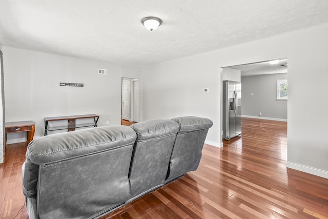 2705 Margo St, Bellevue, NE 68147 - living area with wood finished floors and a textured ceiling
