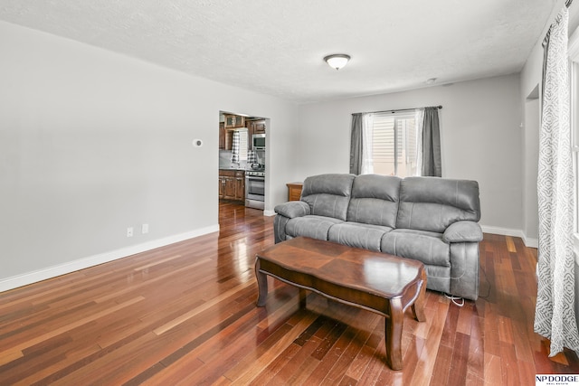 2705 Margo St, Bellevue, NE 68147 - living room featuring dark wood-type flooring and baseboards