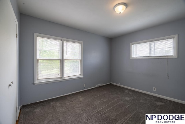 116 E Hillcrest Dr, Seward, NE 68434 - spare room with dark carpet and baseboards