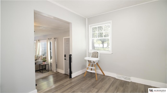 1757 N Linden St, Wahoo, NE 68066 - empty room with wood finished floors, healthy amount of natural light, and crown molding