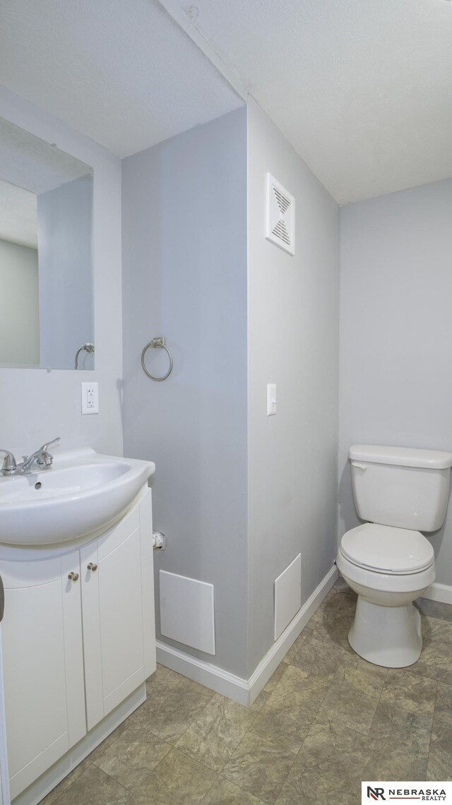 1757 N Linden St, Wahoo, NE 68066 - bathroom featuring vanity and stone finish floors