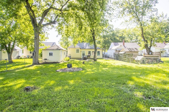 1757 N Linden St, Wahoo, NE 68066 - fenced backyard with an outdoor fire pit
