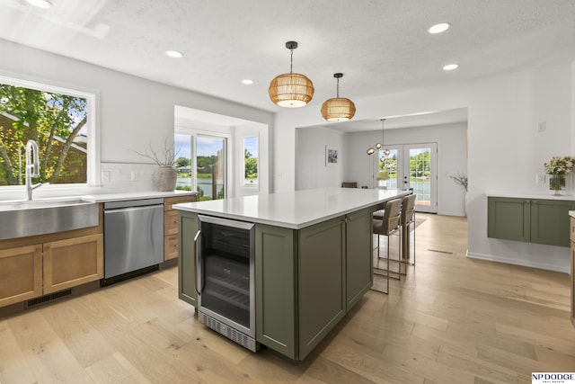 12328 Rose Ln, Omaha, NE 68154 - kitchen with dishwasher, wine cooler, green cabinets, recessed lighting, and french doors