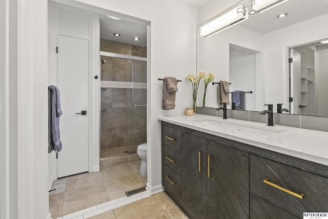 12328 Rose Ln, Omaha, NE 68154 - full bathroom featuring vanity, a shower stall, recessed lighting, and tile patterned floors