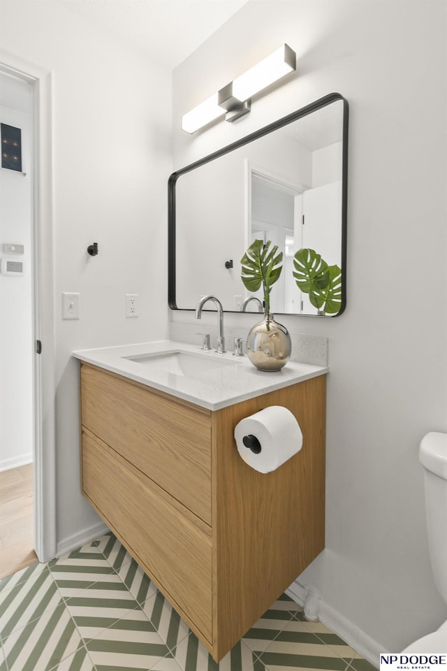 12328 Rose Ln, Omaha, NE 68154 - bathroom with vanity and tile patterned flooring