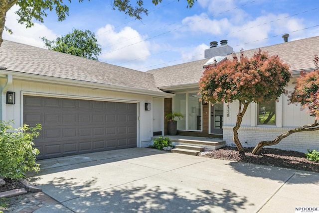 12328 Rose Ln, Omaha, NE 68154 - single story home with a shingled roof, concrete driveway, brick siding, a chimney, and a garage