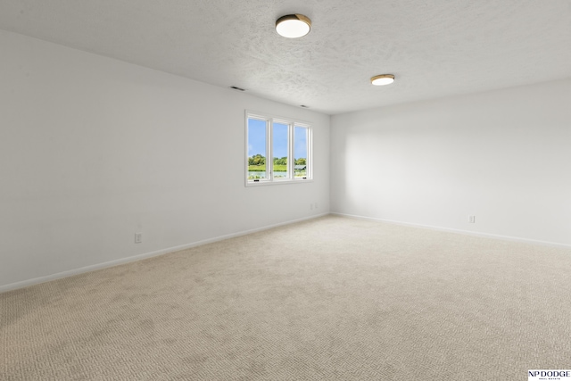 12328 Rose Ln, Omaha, NE 68154 - unfurnished room with light carpet and a textured ceiling