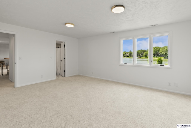 12328 Rose Ln, Omaha, NE 68154 - empty room featuring light carpet and a textured ceiling