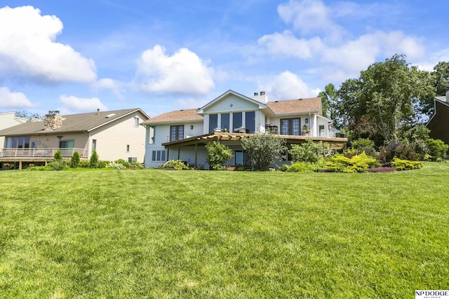 12328 Rose Ln, Omaha, NE 68154 - back of house featuring a yard