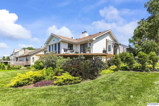 12328 Rose Ln, Omaha, NE 68154 - back of property with a chimney, a lawn, and stucco siding