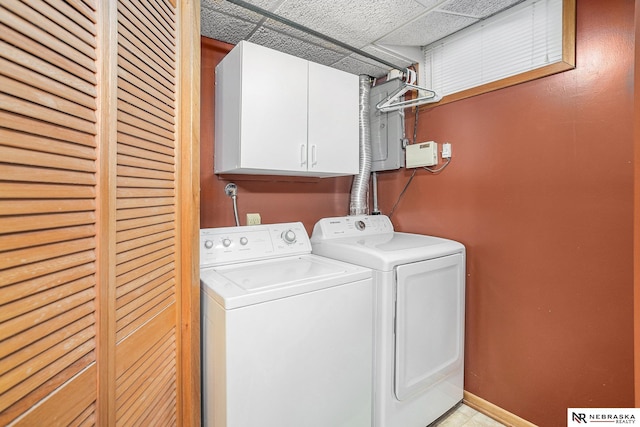 2219 Independence Dr, Lincoln, NE 68521 - laundry area with cabinet space and washing machine and dryer