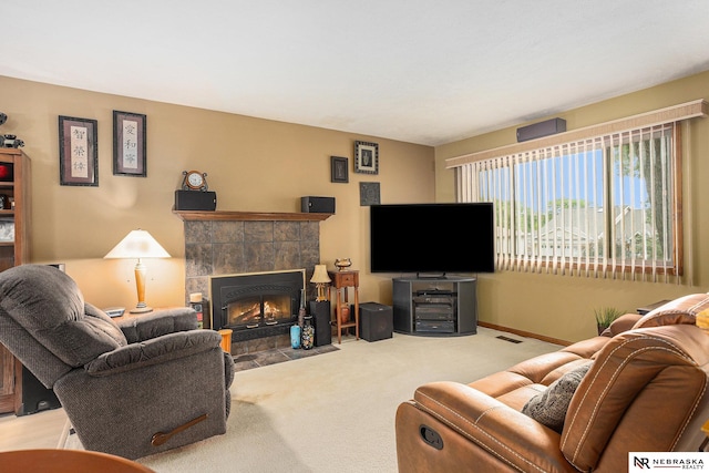 2219 Independence Dr, Lincoln, NE 68521 - carpeted living area with a tile fireplace