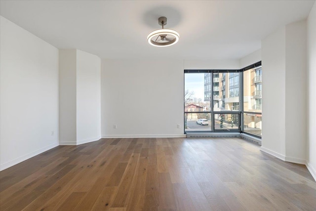200 S 31st Ave Unit 4209, Omaha, NE 68131 - empty room with wood finished floors and baseboards