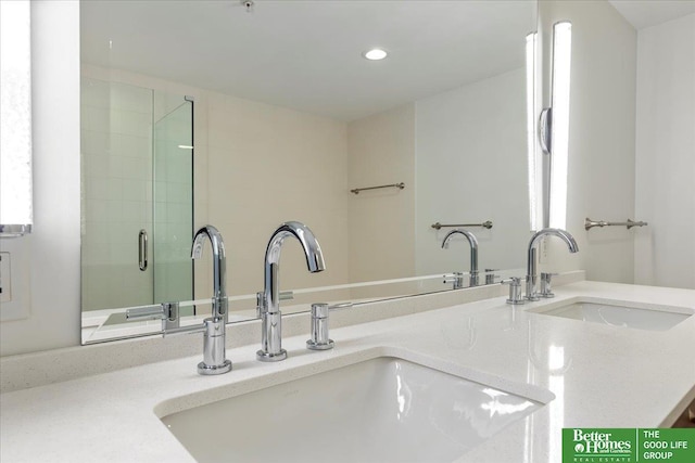 200 S 31st Ave Unit 4209, Omaha, NE 68131 - bathroom view of double vanity, recessed lighting, and a shower with door
