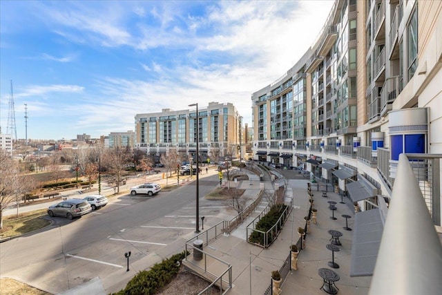 200 S 31st Ave Unit 4209, Omaha, NE 68131 - view of concrete road with sidewalks, a city view, and curbs