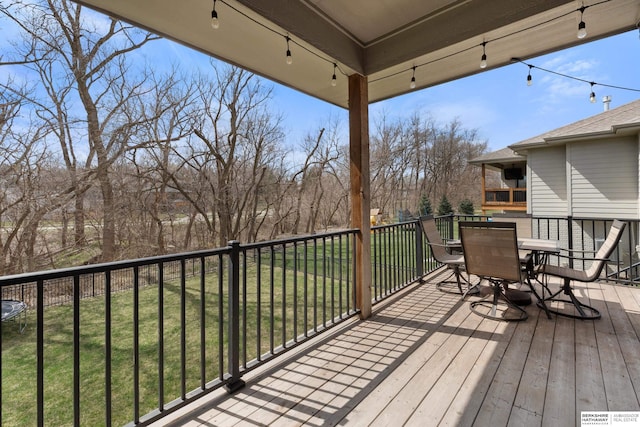 2506 N 188th St, Elkhorn, NE 68022 - wooden deck with outdoor dining area and a yard